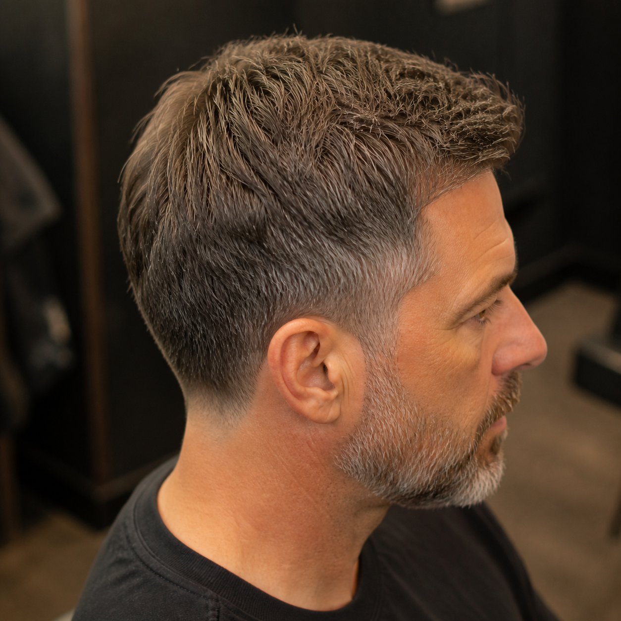 Classic salt-and-pepper scissor cut finished at Fade & Co.